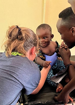 PA-C Cory examining a patient during clinic